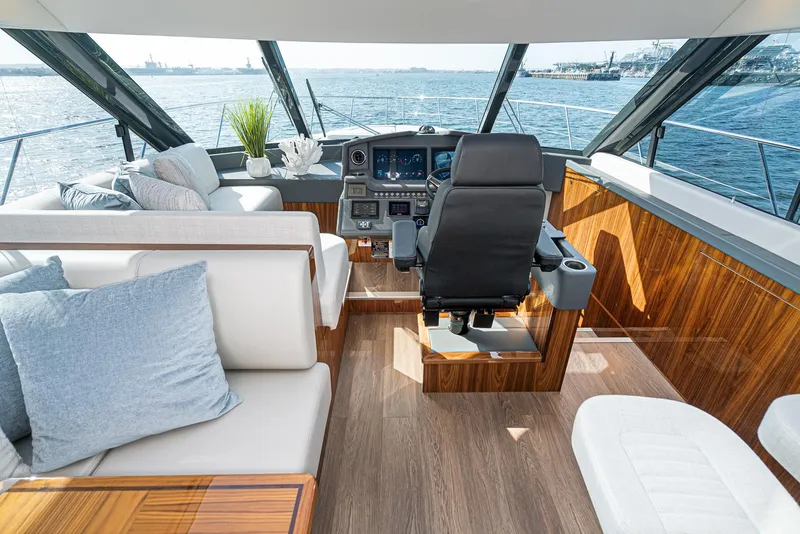 Slide: The Image of Luxurious interior of 2023 Riviera 5400 Sport Yacht with modern helm and seating. - 35