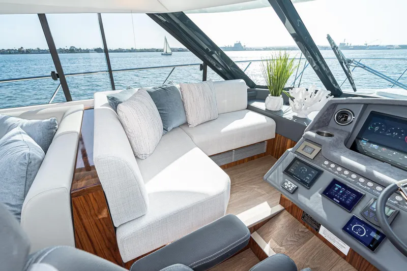 Slide: The Image of Luxurious interior of 2023 Riviera 5400 Sport Yacht with plush seating and modern dashboard. - 36