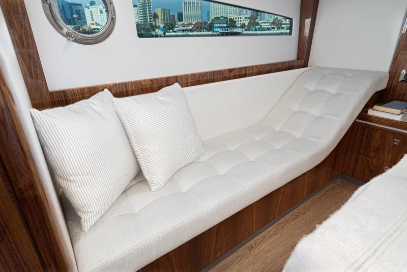 Slide: The Image of Luxurious interior of 2023 Riviera 5400 Sport Yacht with plush seating and elegant decor. - 42