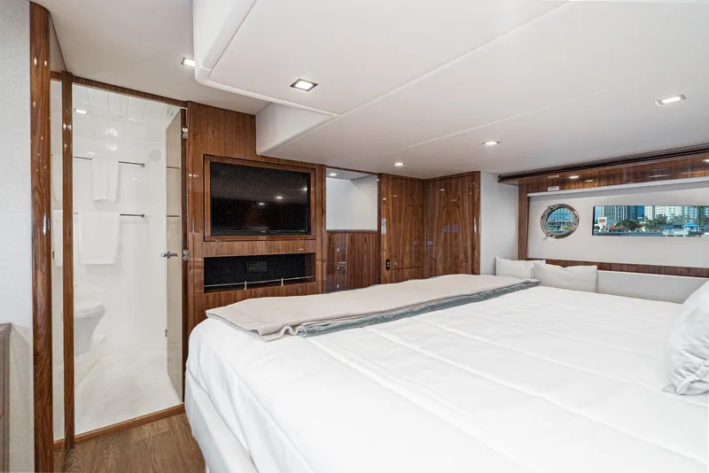 Slide: The Image of Luxurious bedroom interior of 2023 Riviera 5400 Sport Yacht with modern amenities. - 43