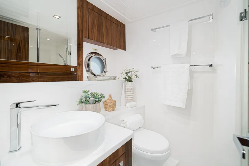 Slide: The Image of Luxurious bathroom in 2023 Riviera 5400 Sport Yacht with modern fixtures and elegant decor. - 49