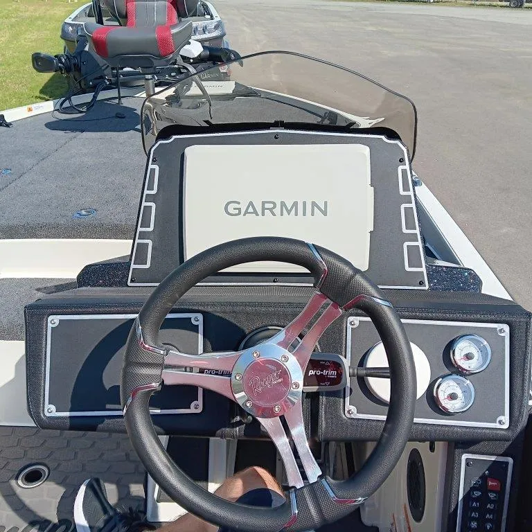 Slide: The Image of 2025 Ranger Z520 boat dashboard with Garmin display and steering wheel. - 11