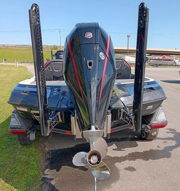 Slide: The Image of 2025 Ranger Z520 boat, rear view with motor and dual power poles. - 2