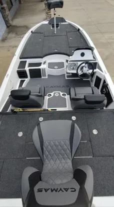 Slide: The Image of 2025 Caymas CX21 Pro boat interior with modern seating and dashboard design. - 7