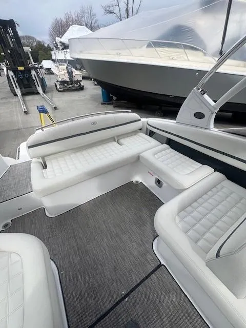 Slide: The Image of 2018 Cobalt R5 boat interior with white seating and gray flooring. - 15