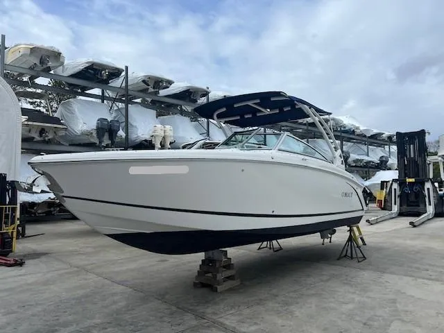 Slide: The Image of 2018 Cobalt R5 boat on dry dock, surrounded by other stored boats. - 4