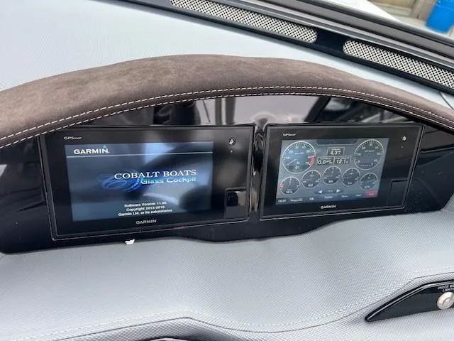 Slide: The Image of Dashboard of a 2018 Cobalt R5 boat featuring Garmin navigation displays. - 6