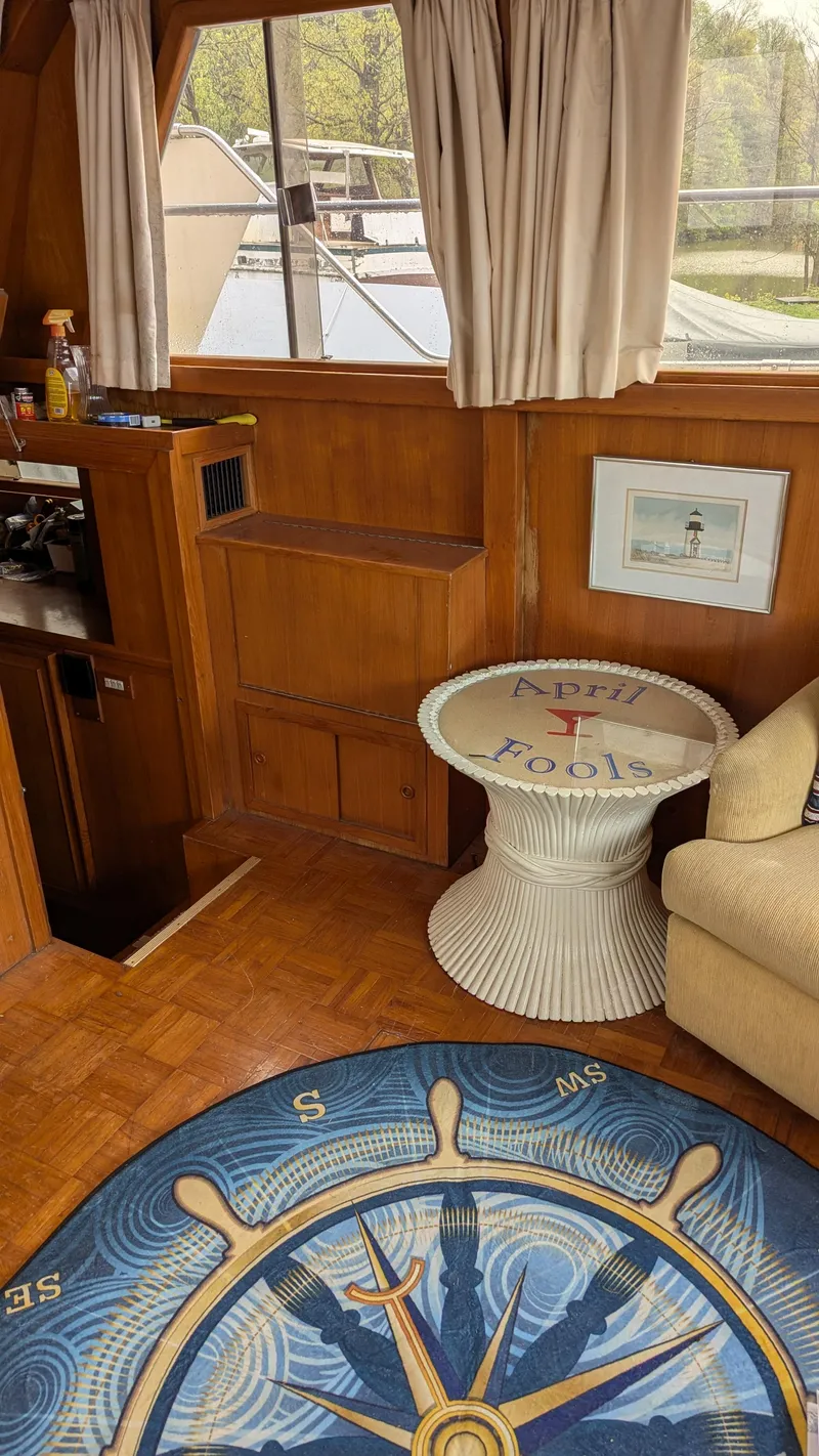 Slide: The Image of Interior of 1989 Jefferson 42 SE Sundeck Motor Yacht with nautical decor and wooden furnishings. - 11