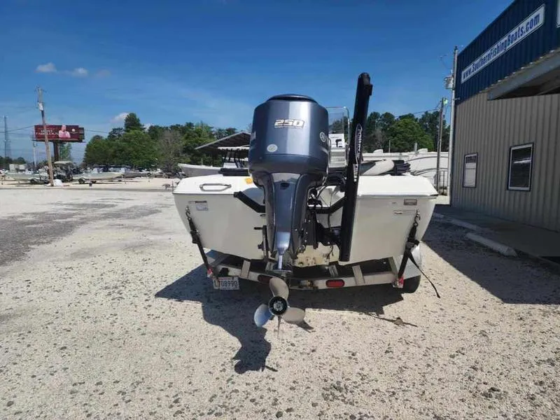 Slide: The Image of 2014 Skeeter SX2250 boat with 250 HP engine, parked outdoors. - 3