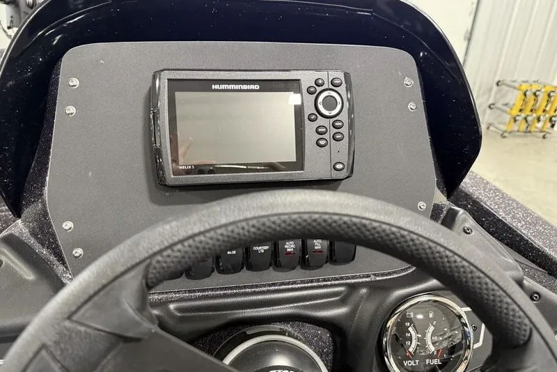 Slide: The Image of 2025 Skeeter ZX150 dashboard with Humminbird Helix 5 fishfinder and control panel. - 11