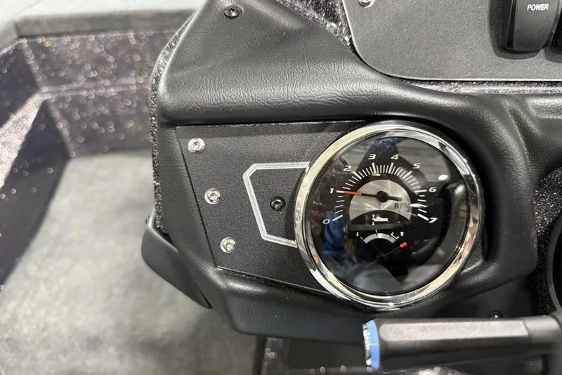Slide: The Image of 2025 Skeeter ZX150 dashboard with RPM gauge and power switch. - 16