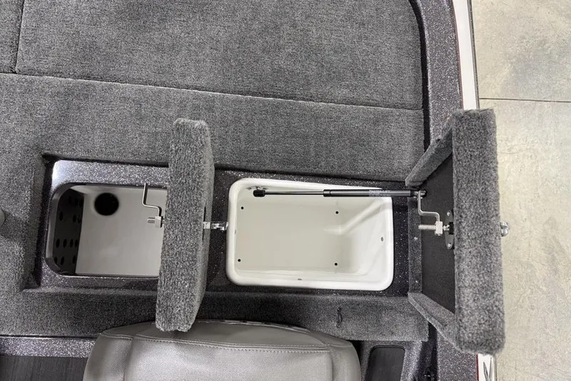 Slide: The Image of 2025 Skeeter ZX150 boat storage compartments with open lids, showcasing interior design. - 20