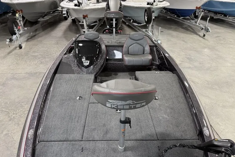 Slide: The Image of 2025 Skeeter ZX150 bass boat interior with seating and control panel. - 22