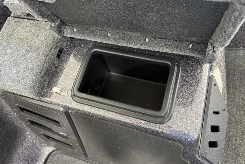 Slide: The Image of Open storage compartment in 2025 Skeeter ZX150 boat interior. - 9