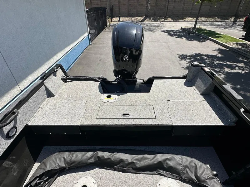 Slide: The Image of 2021 Crestliner 1700 Vision boat with motor, parked outdoors on a sunny day. - 13