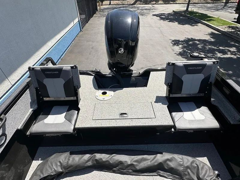 Slide: The Image of 2021 Crestliner 1700 Vision boat interior with dual seats and motor. - 14