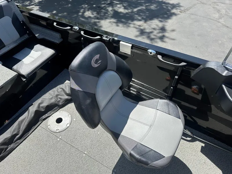 Slide: The Image of 2021 Crestliner 1700 Vision boat interior with gray and black seating. - 18