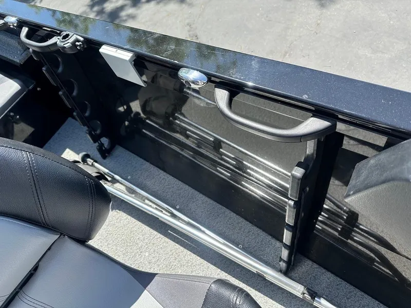 Slide: The Image of 2021 Crestliner 1700 Vision boat interior with seating and storage features. - 19