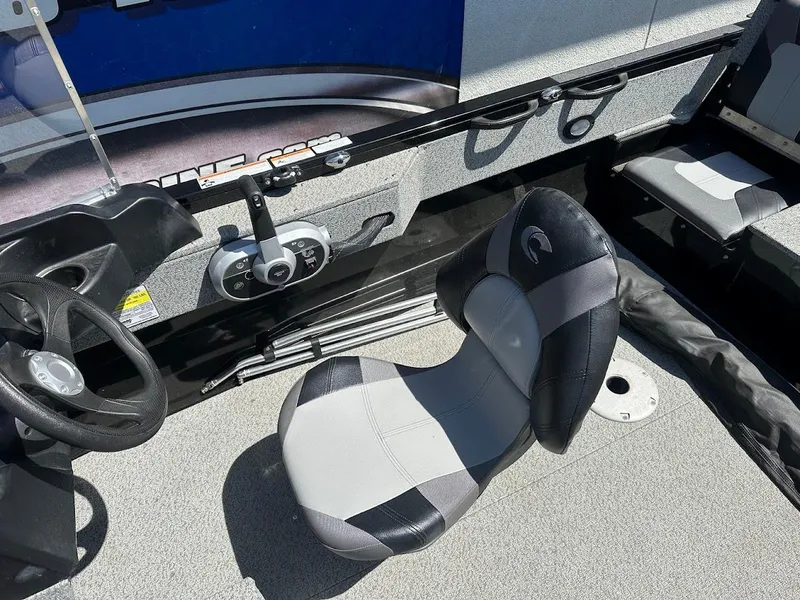Slide: The Image of 2021 Crestliner 1700 Vision boat interior with steering wheel and seat. - 20