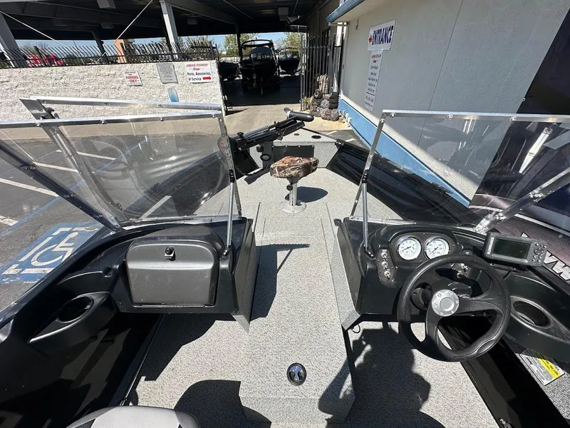Slide: The Image of 2021 Crestliner 1700 Vision boat interior with dual consoles and steering wheel. - 24