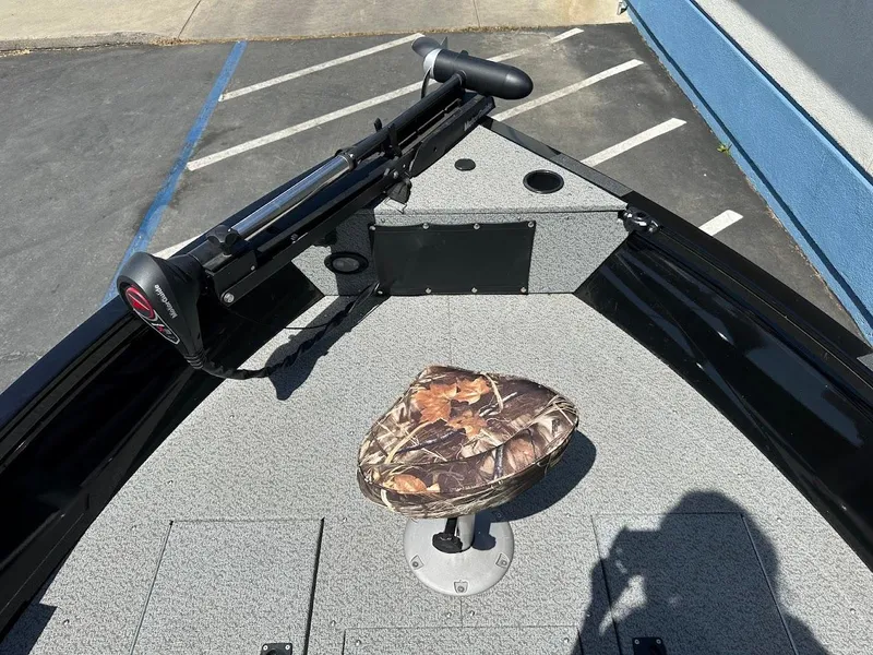 Slide: The Image of Crestliner 1700 Vision 2021 boat deck with camo seat and trolling motor. - 28