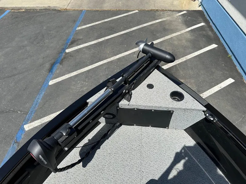 Slide: The Image of 2021 Crestliner 1700 Vision boat with trolling motor on a parking lot. - 29