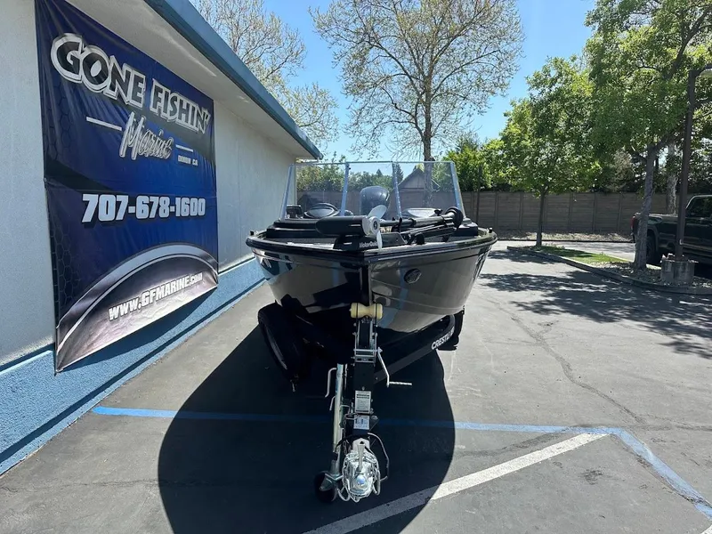 Slide: The Image of 2021 Crestliner 1700 Vision boat on trailer at dealership, sunny day. - 3