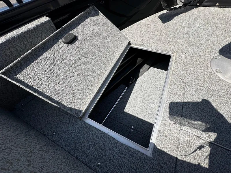 Slide: The Image of Open storage compartment on 2021 Crestliner 1700 Vision boat deck. - 31