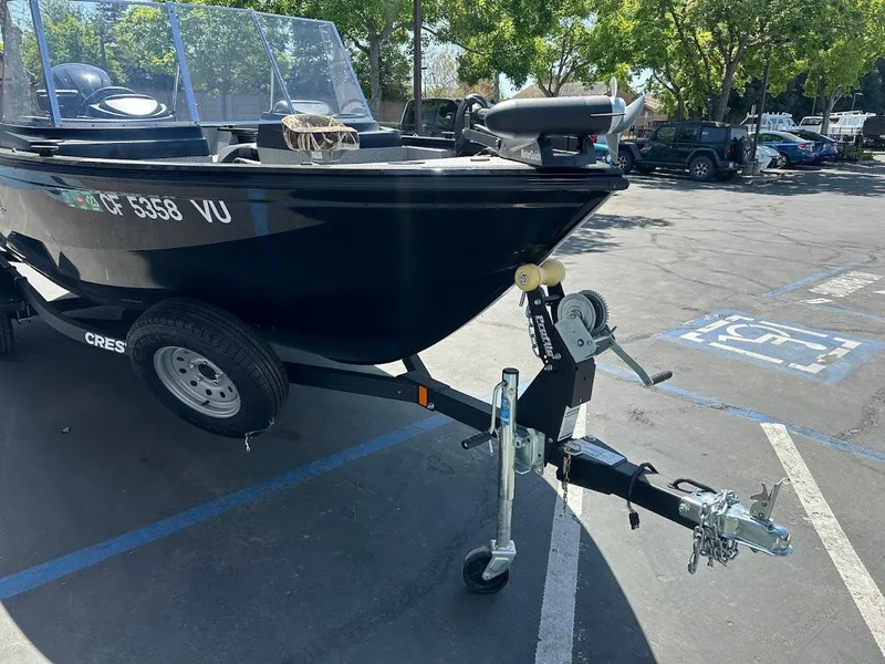 Slide: The Image of 2021 Crestliner 1700 Vision boat on trailer in parking lot. - 5