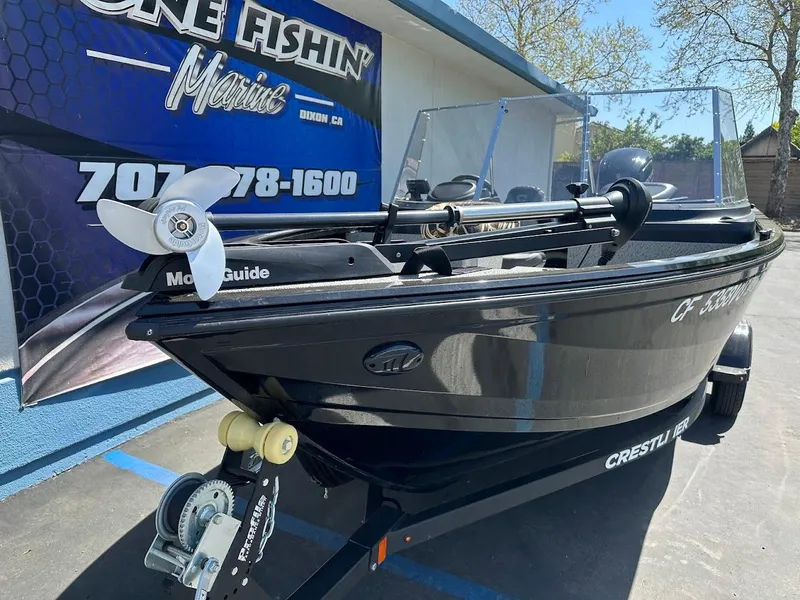 Slide: The Image of 2021 Crestliner 1700 Vision boat on trailer at marine dealership. - 6
