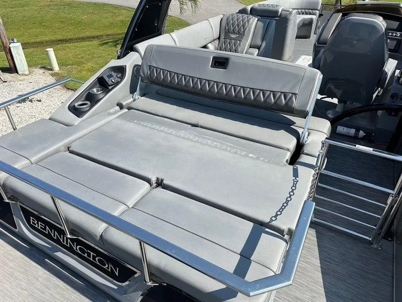 Slide: The Image of 2021 Bennington 25 RXSB boat with luxurious gray seating and sleek design. - 12