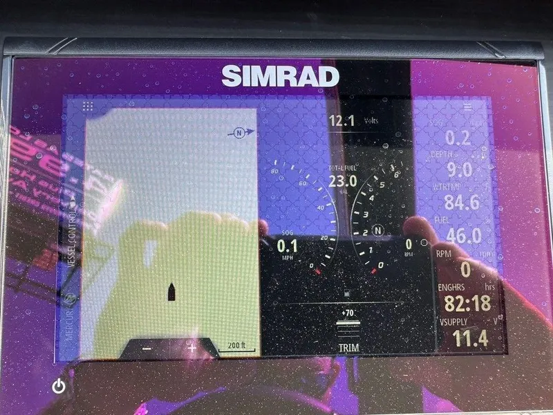 Slide: The Image of Simrad display on 2021 Bennington 25 RXSB showing navigation and engine data. - 3