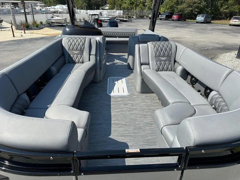 Slide: The Image of 2021 Bennington 25 RXSB pontoon boat with luxurious gray seating and spacious interior. - 8