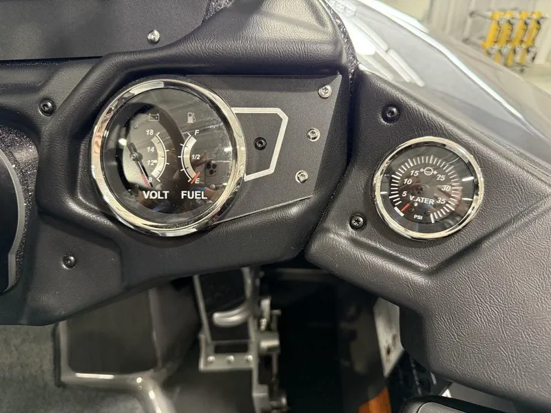 Slide: The Image of Dashboard of 2025 Skeeter ZXR20 showing volt, fuel, and water pressure gauges. - 14