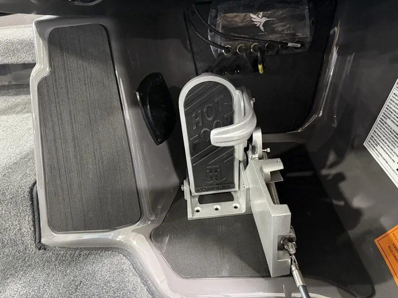 Slide: The Image of Foot pedal control in a 2025 Skeeter ZXR20 boat cockpit. - 15
