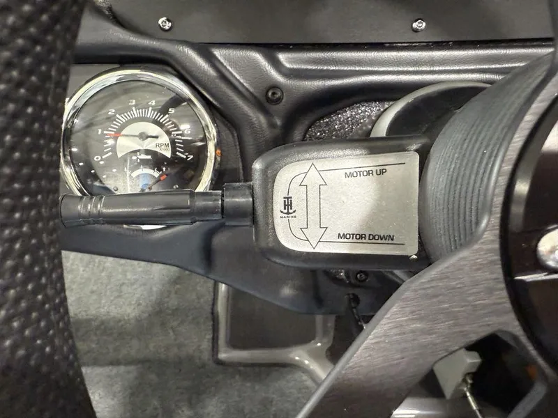 Slide: The Image of Close-up of Skeeter ZXR20 2025 boat dashboard with RPM gauge and motor control switch. - 17