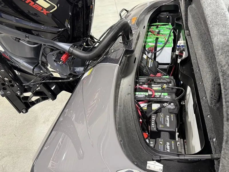 Slide: The Image of Skeeter ZXR20 2025 boat with exposed battery compartment and engine components. - 19