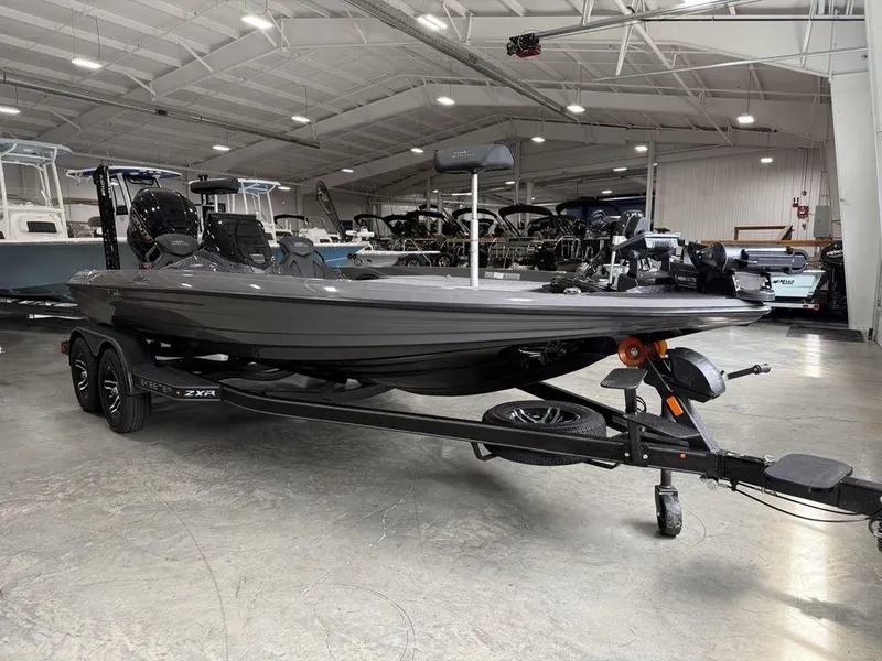 Slide: The Image of 2025 Skeeter ZXR20 boat on trailer in indoor showroom. - 5
