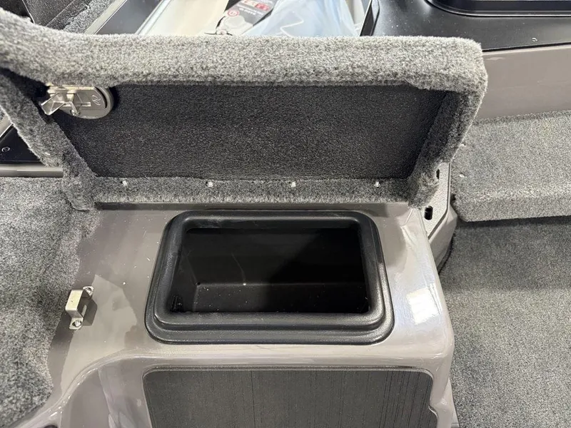 Slide: The Image of 2025 Skeeter ZXR20 storage compartment with open lid, showcasing interior space. - 8