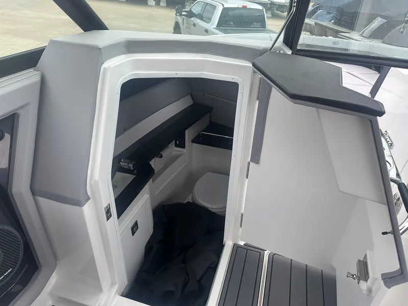Slide: The Image of Interior cabin of 2023 Cobalt R33 boat, featuring seating and storage. - 15