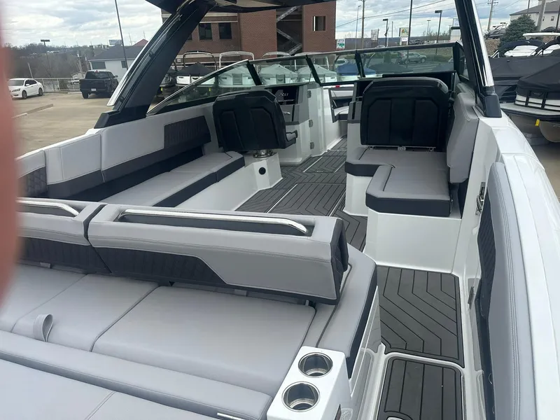 Slide: The Image of 2023 Cobalt R33 boat interior with sleek seating and modern design. - 16