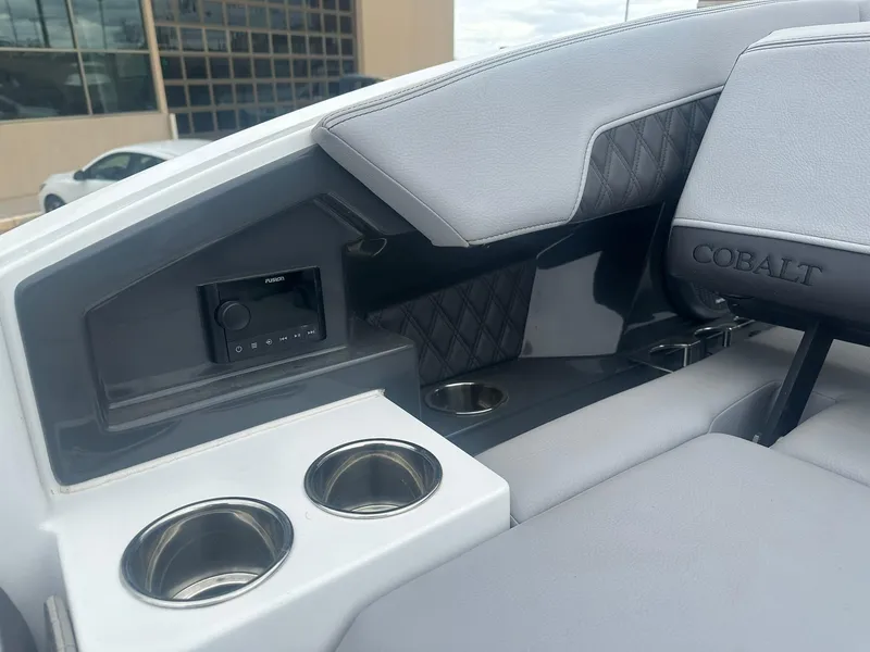 Slide: The Image of Interior of 2023 Cobalt R33 boat with cup holders and cushioned seating. - 21