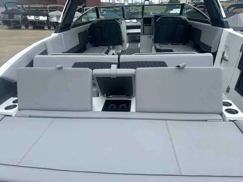 Slide: The Image of 2023 Cobalt R33 boat interior with spacious seating and modern design. - 23