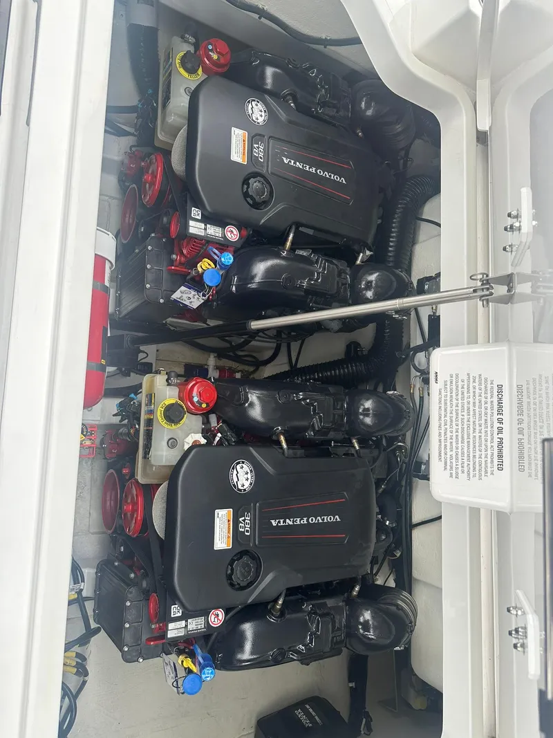 Slide: The Image of 2023 Cobalt R33 boat engine compartment with dual Volvo Penta engines. - 25