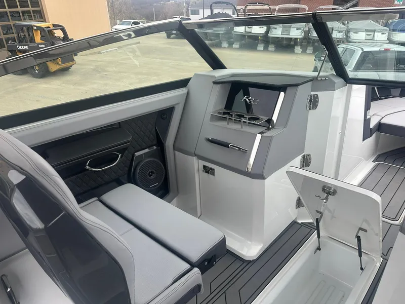 Slide: The Image of 2023 Cobalt R33 boat interior with sleek seating and modern dashboard design. - 36