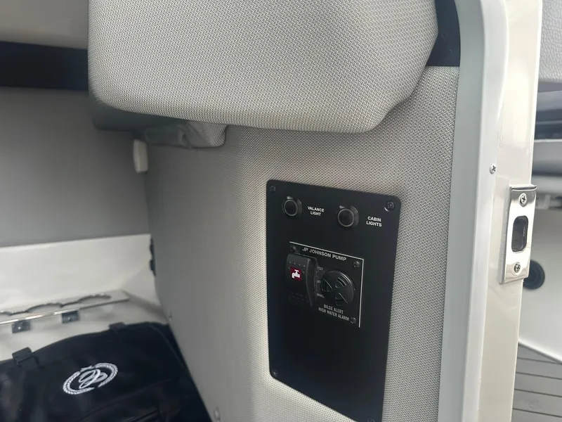 Slide: The Image of 2023 Cobalt R33 interior panel with control switches and fabric upholstery. - 40