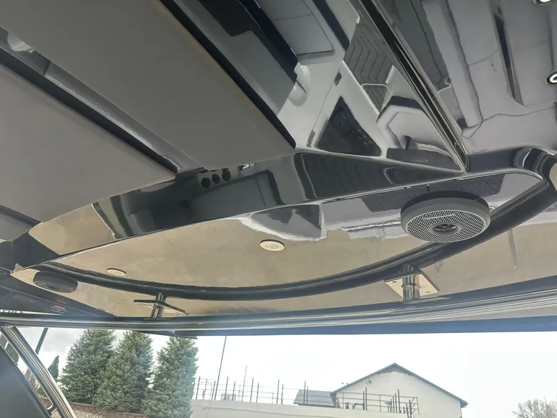 Slide: The Image of 2023 Cobalt R33 boat interior ceiling with sleek design and integrated speaker system. - 49