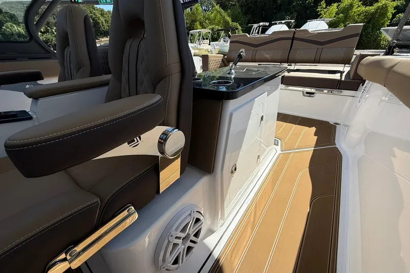 Slide: The Image of Luxurious interior of 2026 Monterey Elite 30 OB boat with plush seating and sleek design. - 17