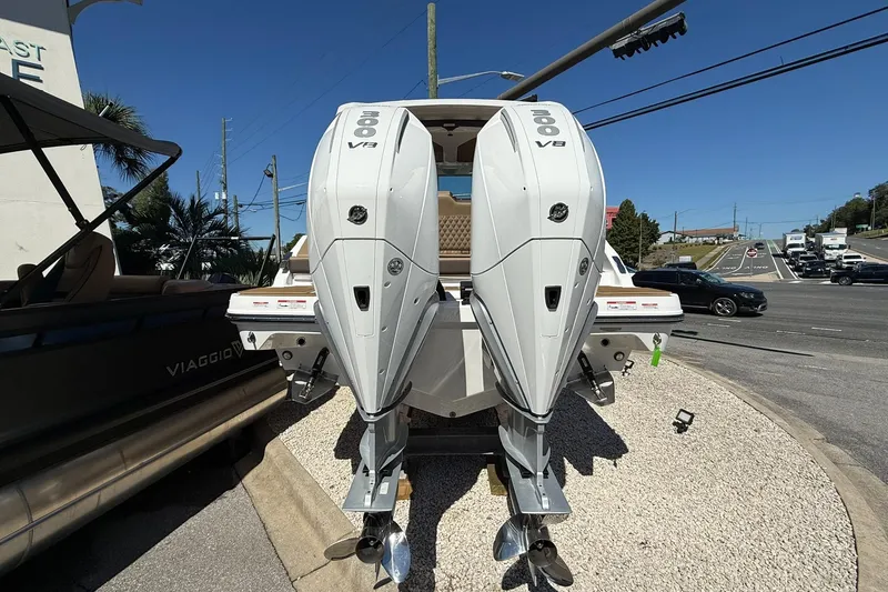 Slide: The Image of 2026 Monterey Elite 30 OB boat with dual 300 V8 outboard engines. - 2