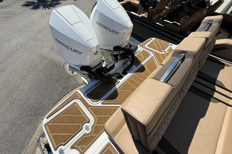 Slide: The Image of 2026 Monterey Elite 30 OB boat with dual Mercury outboard engines and luxurious seating. - 25